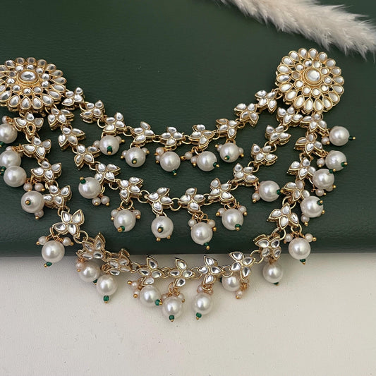 Gold plated kundan and pearl hair accessory