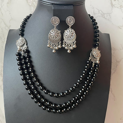 Oxidised big black beads three layered fancy necklace set with matching earrings