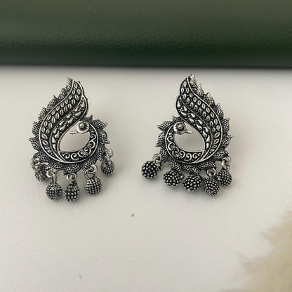 Oxidized earrings in peacock motifs.