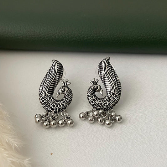 Oxidized earrings in peacock motifs.