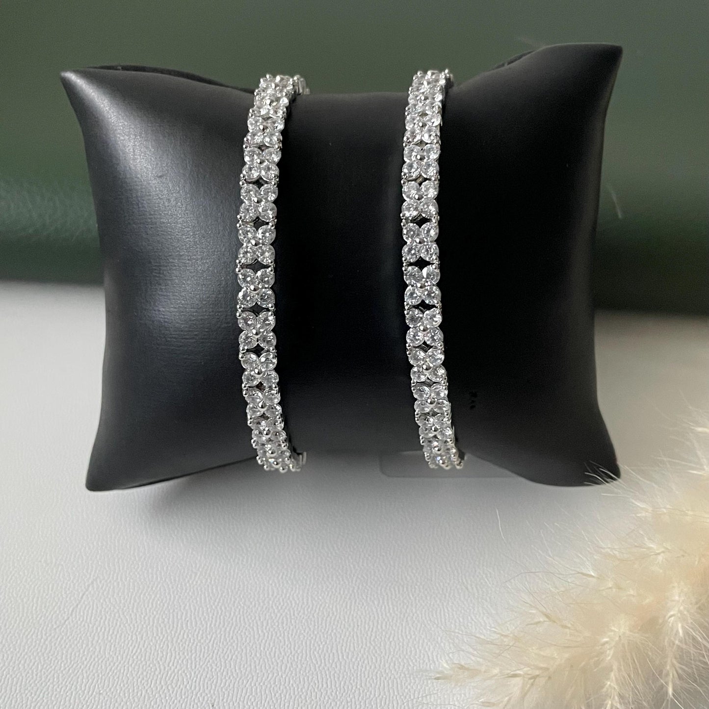 beautiful 4 petal flower design in cubic zirconia rhodium plated bangles