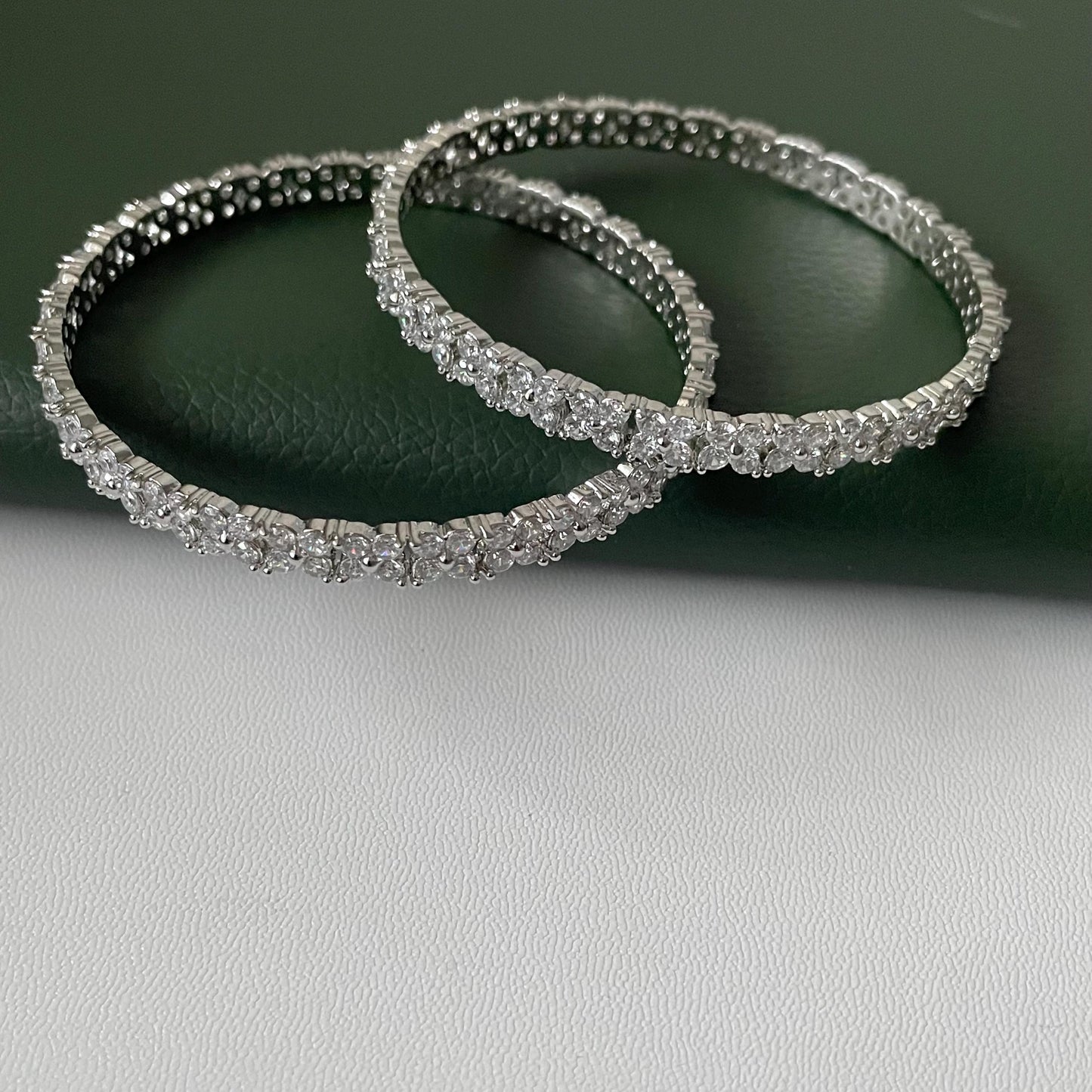 beautiful 4 petal flower design in cubic zirconia rhodium plated bangles