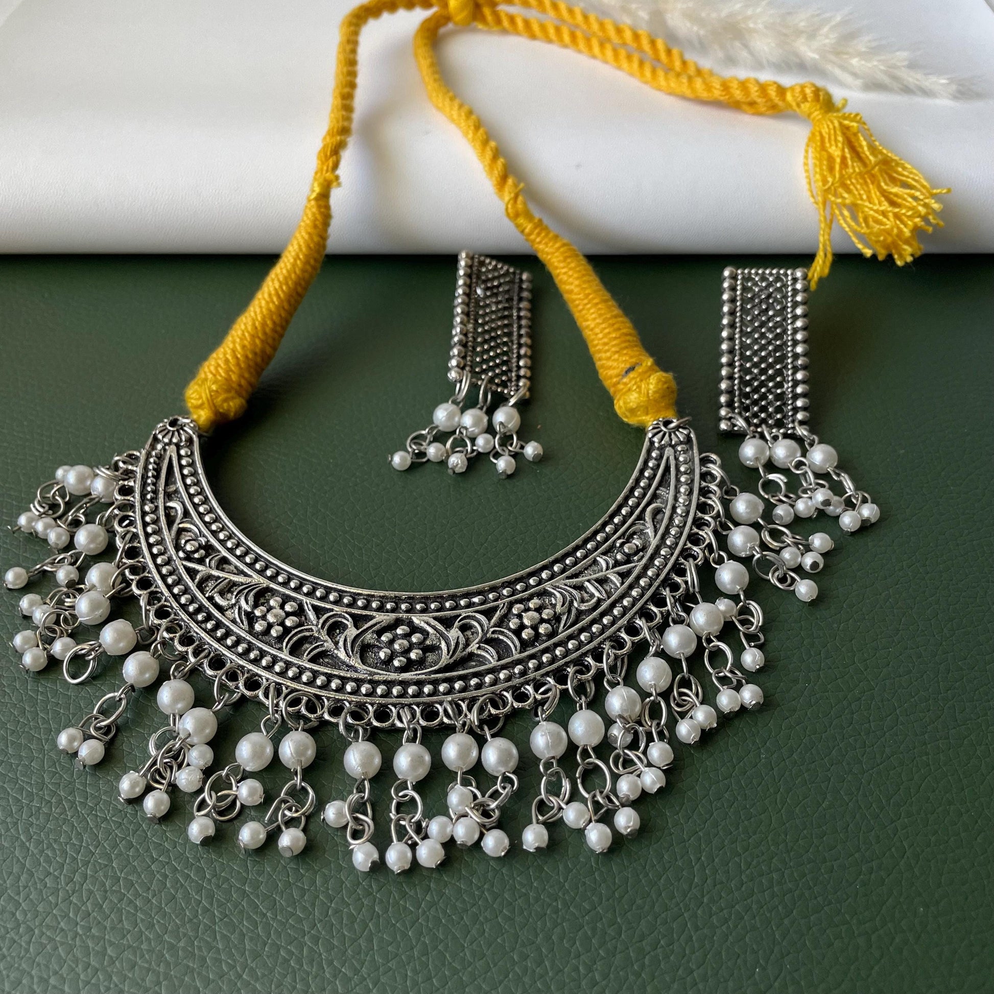 Oxidised thread necklace in red and yellow with matching earrings