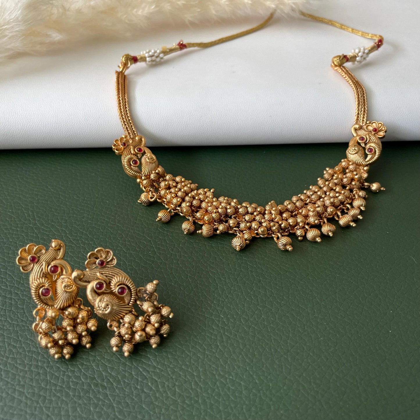 Short gold plated ghungaroo necklace set with peacock earrings