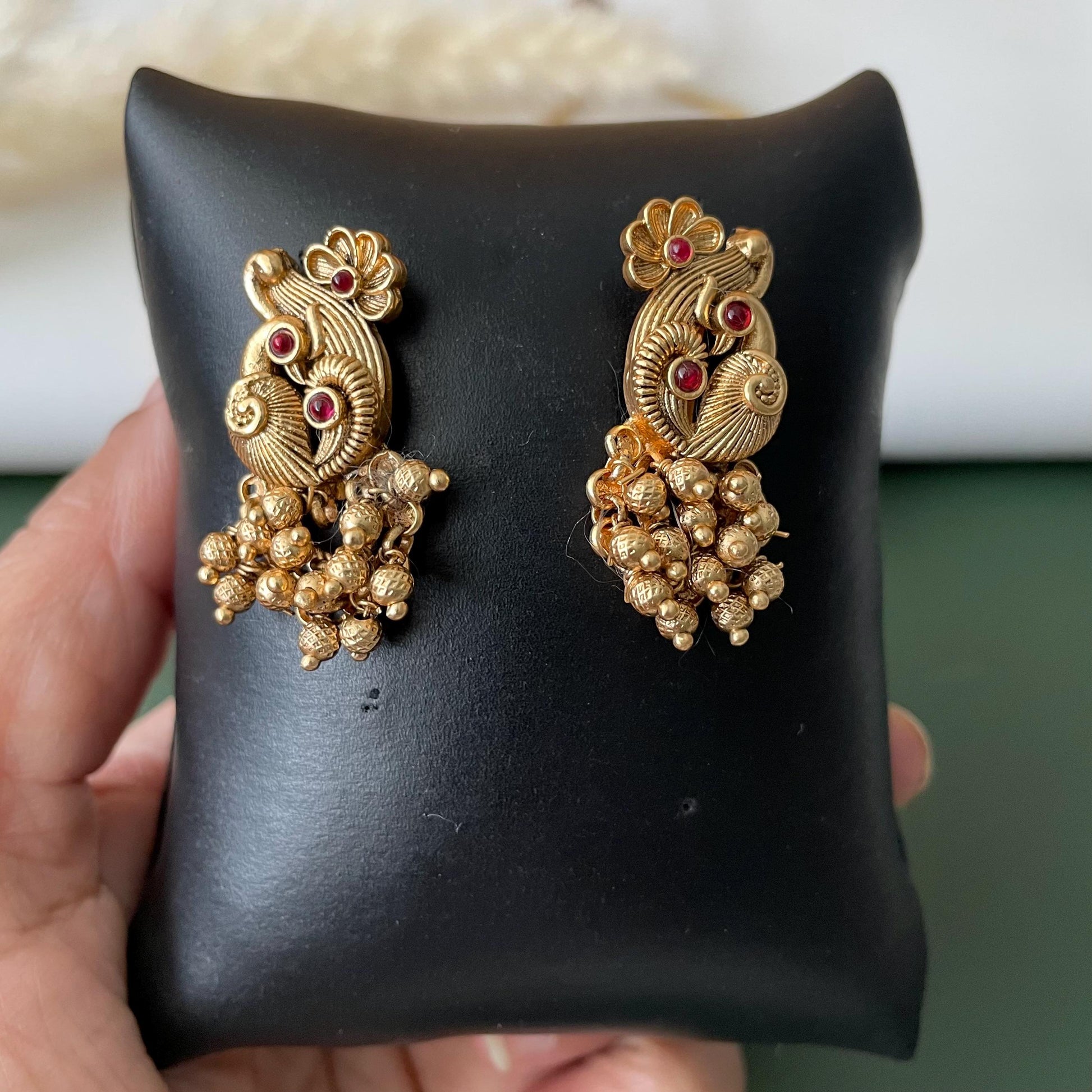 Short gold plated ghungaroo necklace set with peacock earrings