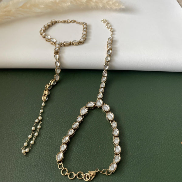 Antique gold colored kundan and pearl haath panja