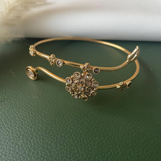 Gold plated l r stones flower motif bajuband. Easy to wear and adjust .