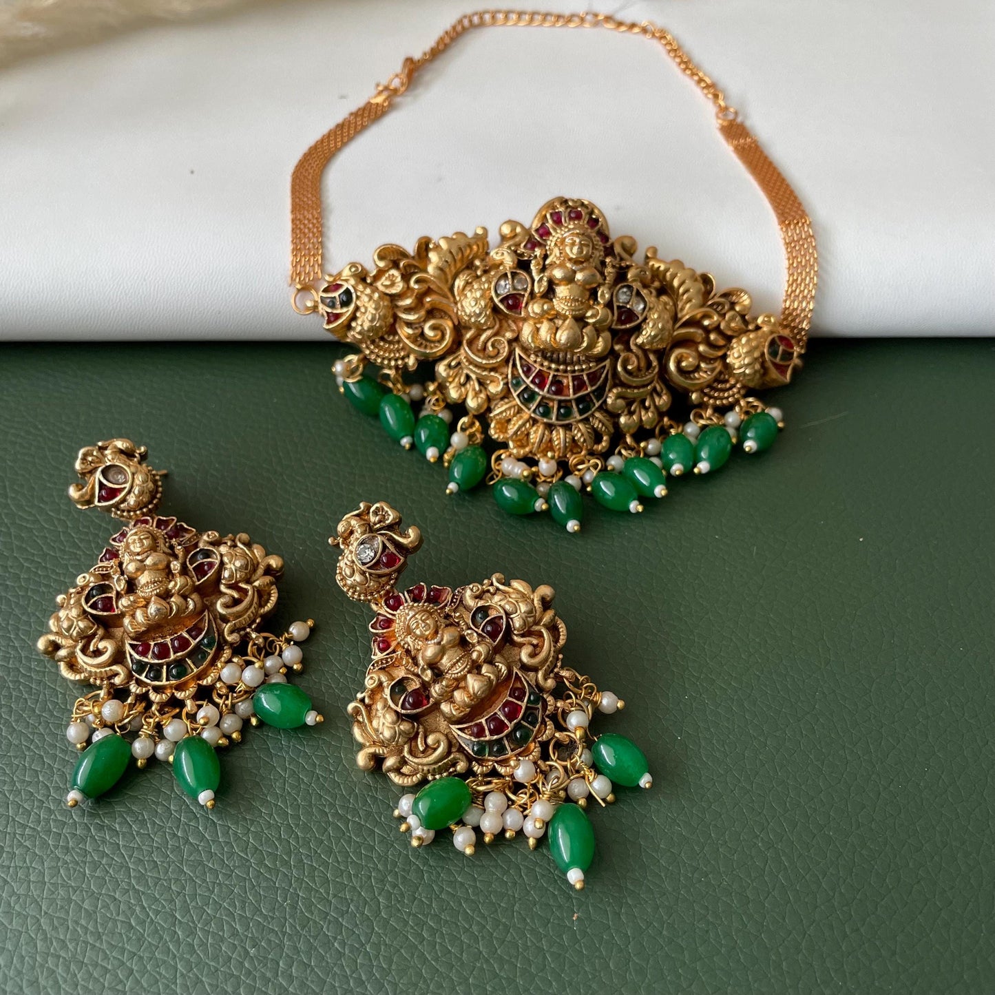 Lakshmi pendent kemp stone antique gold plated choker set with earring in green