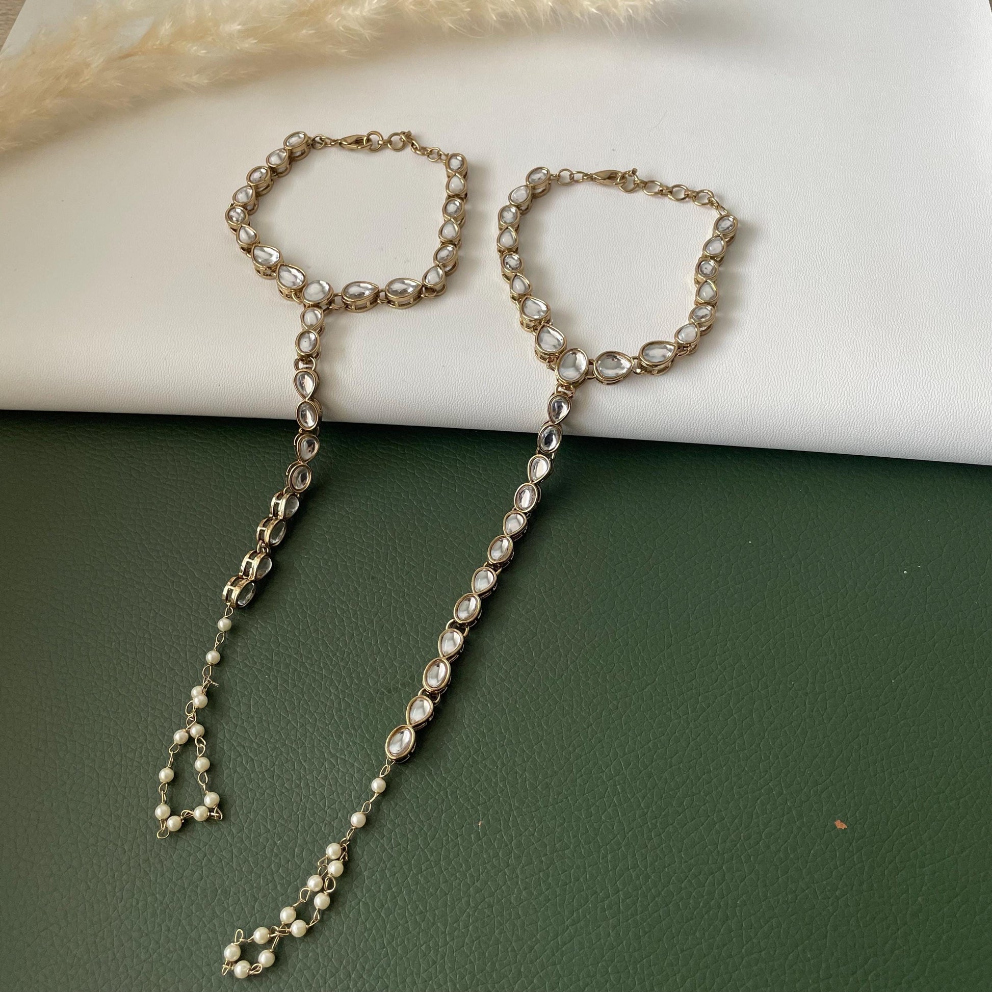 Antique gold colored kundan and pearl haath panja