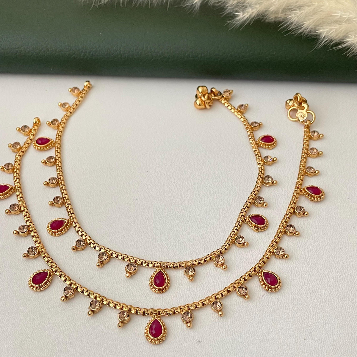 Gold plated bridal payal anklets in Ruby Green and lct
