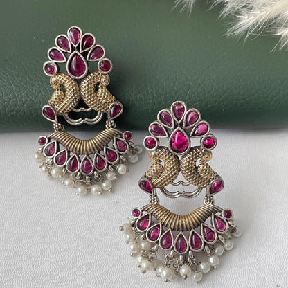 Oxidised dual tone peacock motif earrings