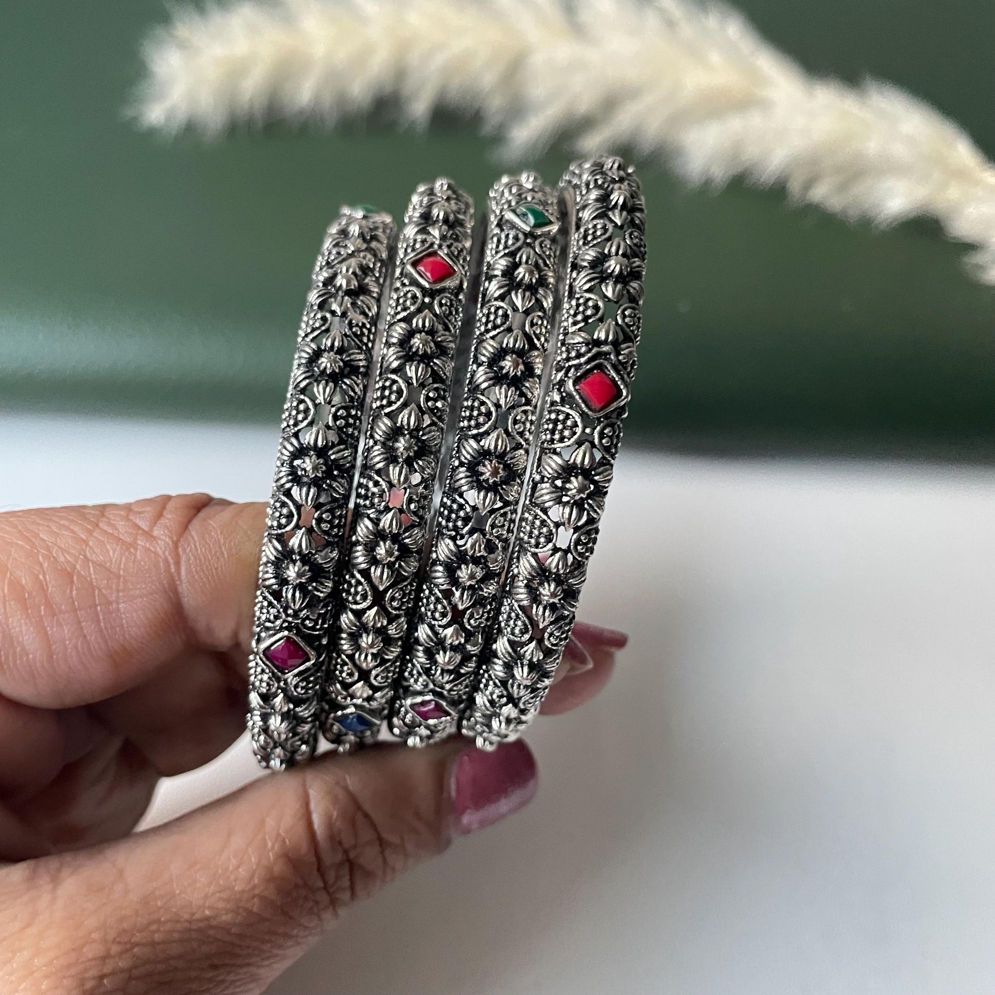 Restocked Oxidized flower motif bangles: Set of 4