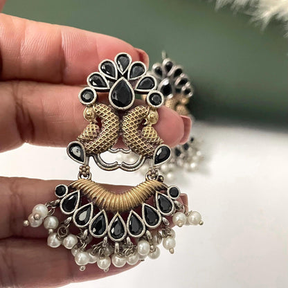 Oxidised dual tone peacock motif earrings