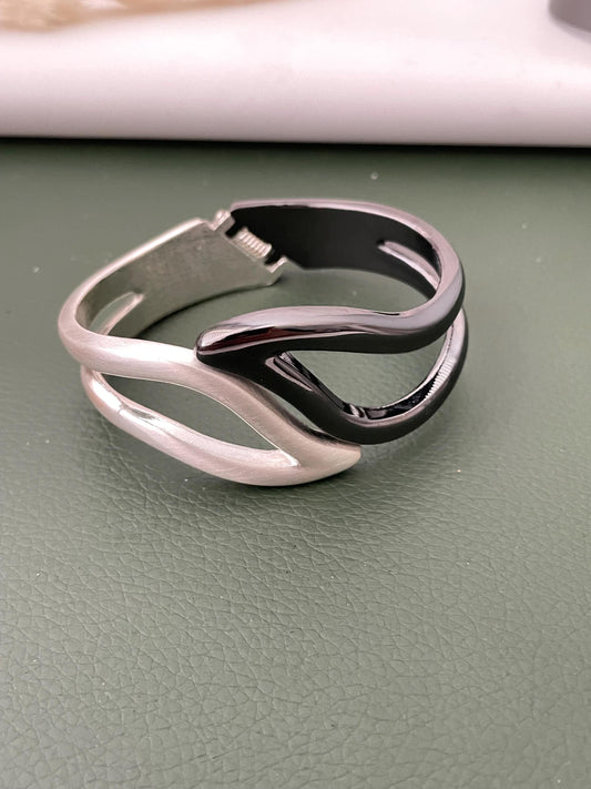 Silver and black fancy cuff bracelets