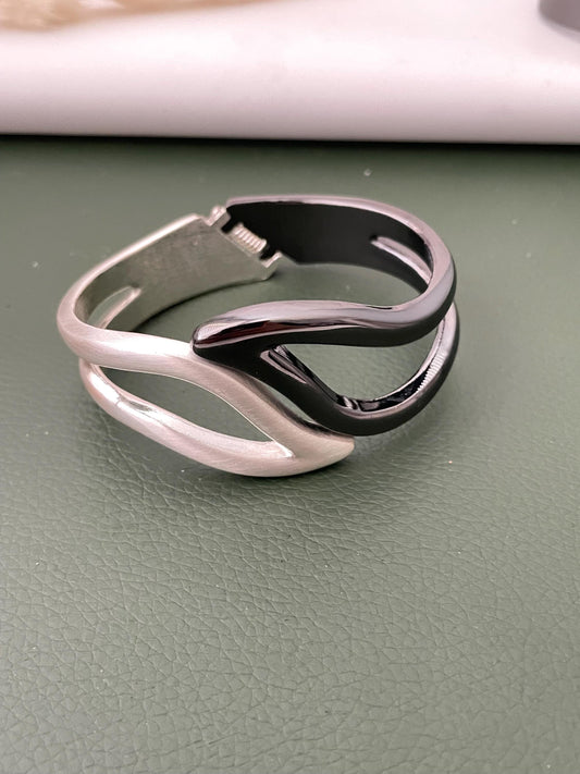 Silver and black fancy cuff bracelets