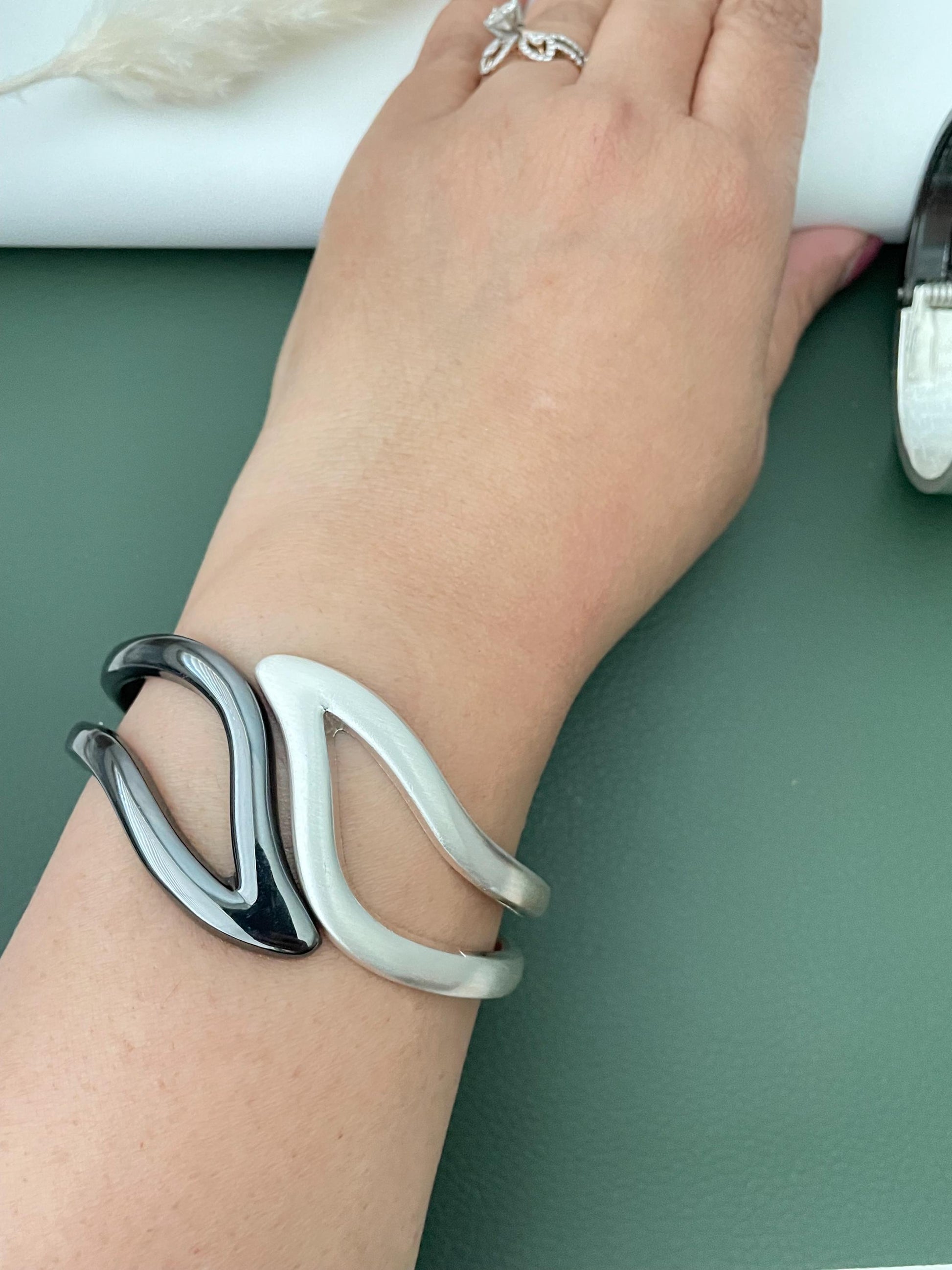 Silver and black fancy cuff bracelets