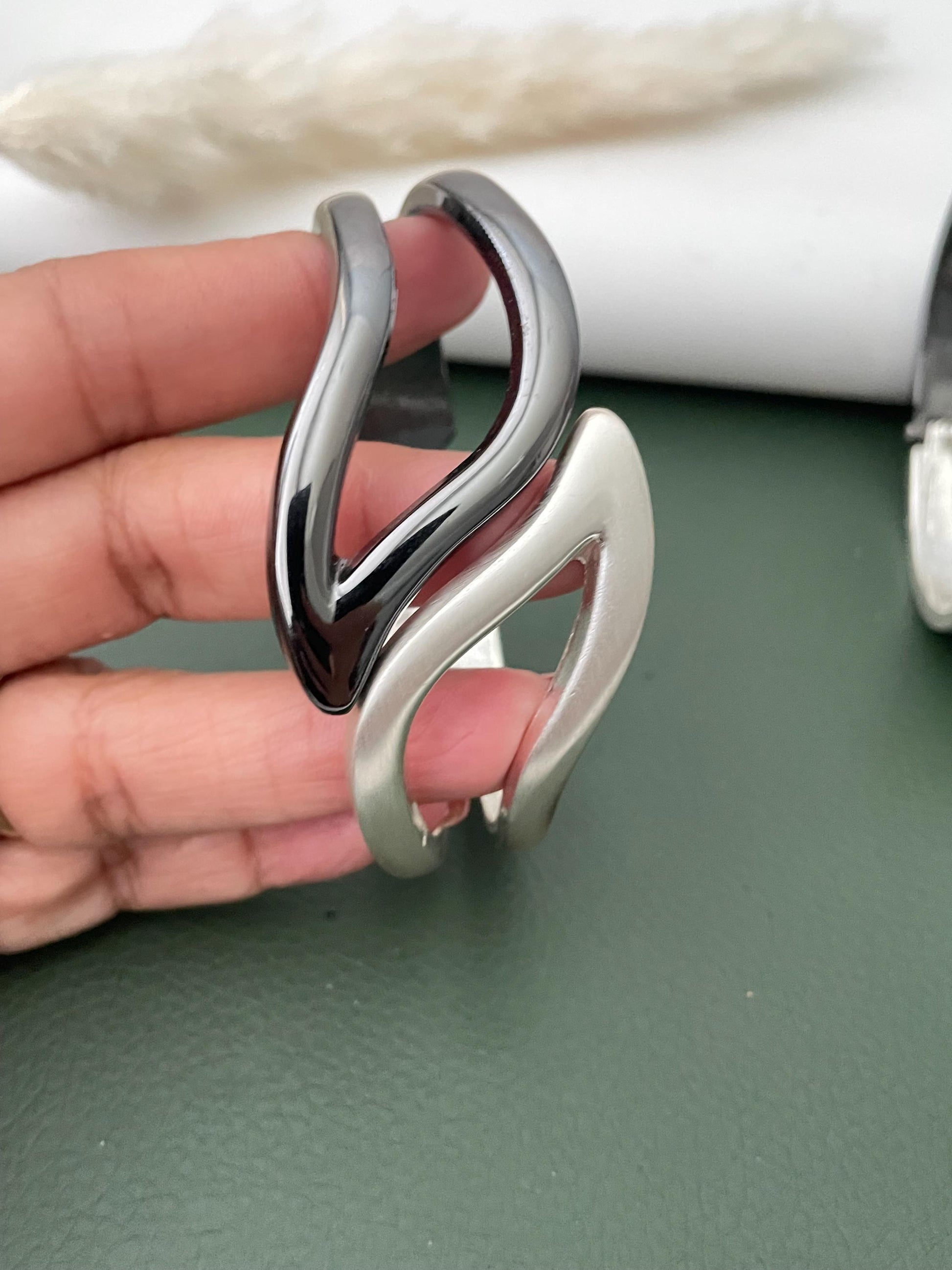Silver and black fancy cuff bracelets