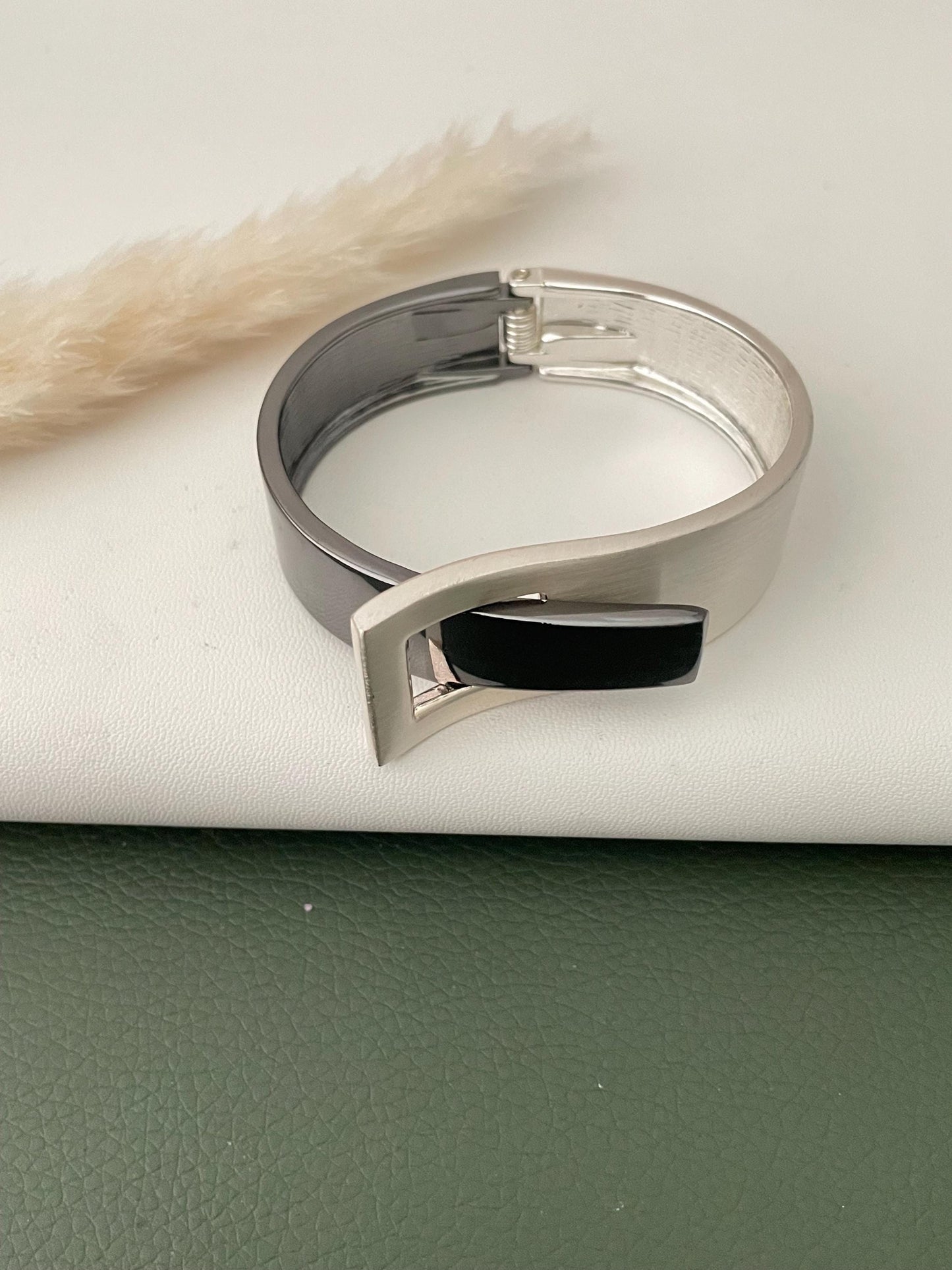Silver and black fancy cuff bracelets