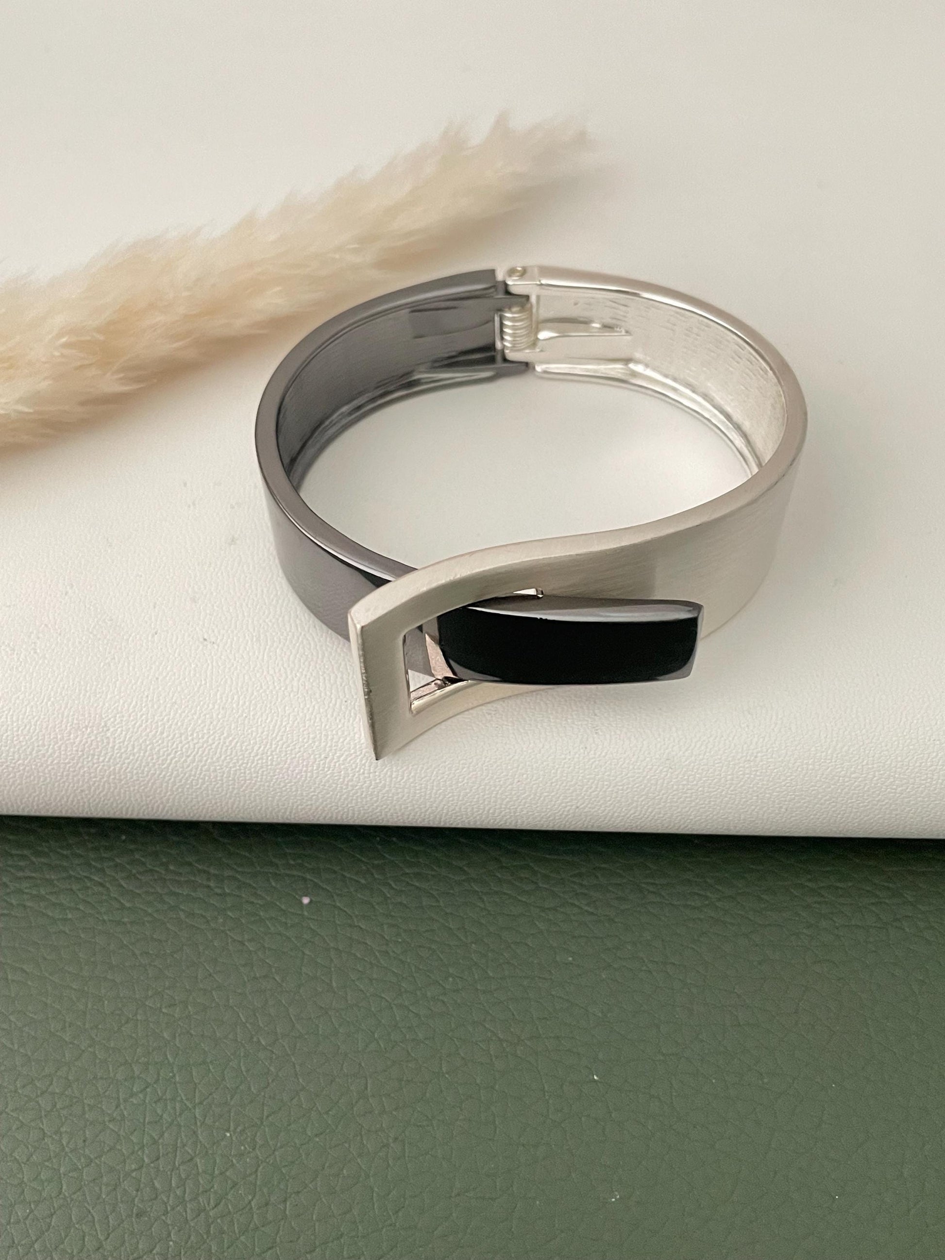 Silver and black fancy cuff bracelets