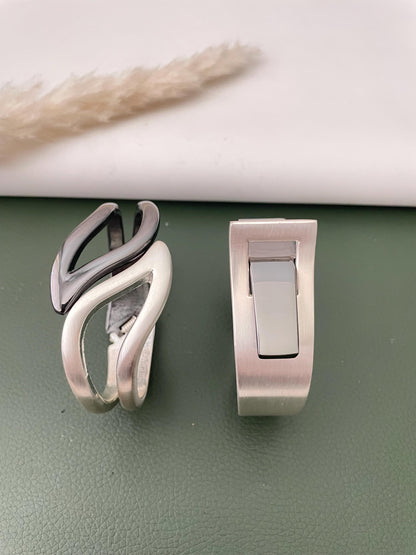 Silver and black fancy cuff bracelets