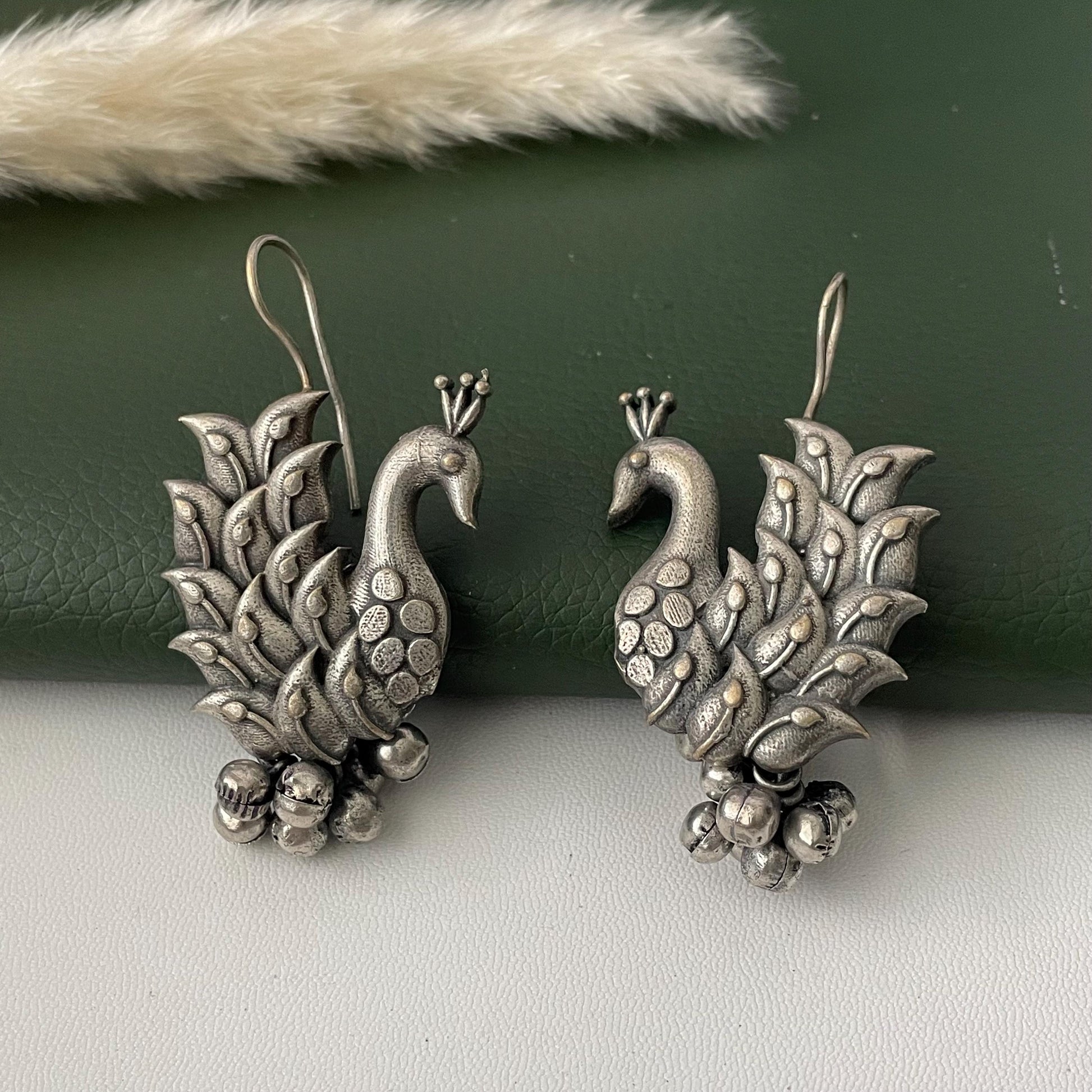 Oxidized peacock dangling earrings