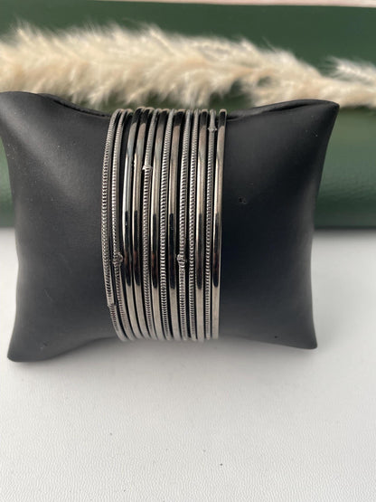Nysaa Oxidised metal and gold metal bangles : set of 12 thin babgles