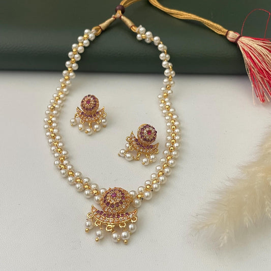 Small Maharashtraian pearl necklace set . With stunning pendent in ruby and white colored gems and matching earrings
