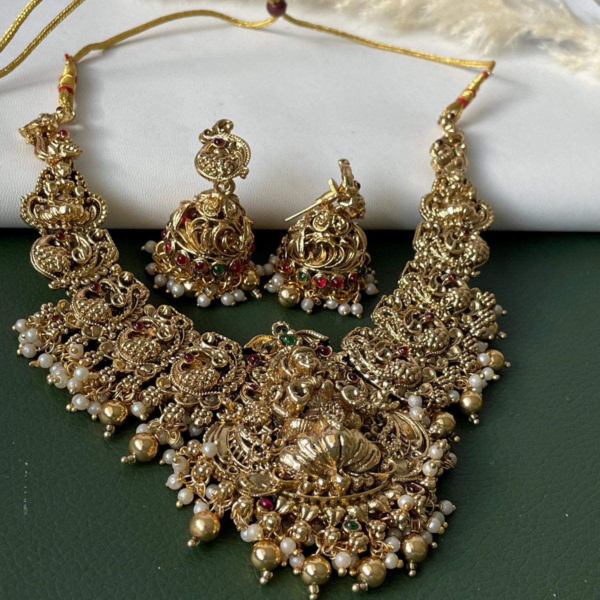 Lakshmi pendent kemp stone antique gold plated choker set with earring in green