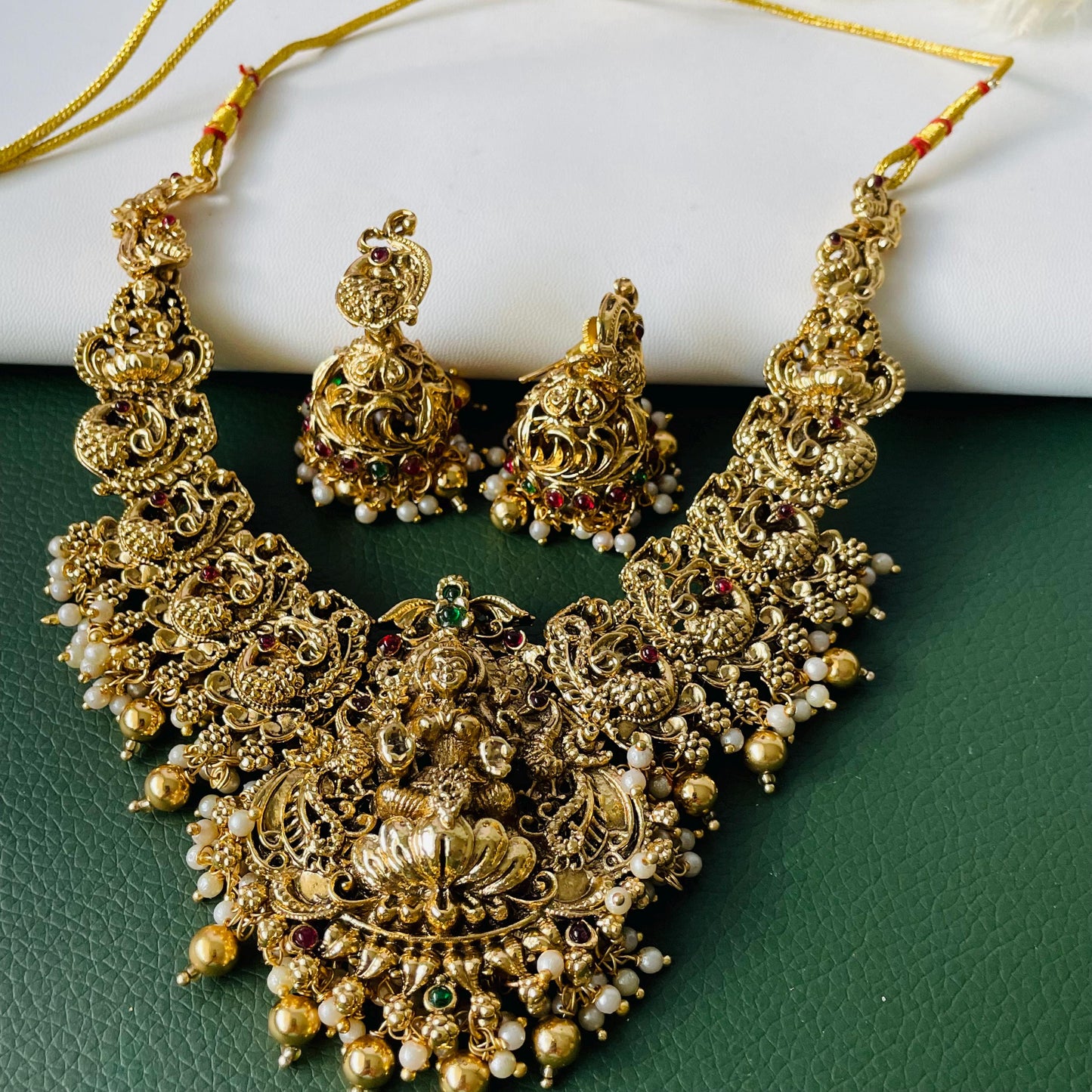 Lakshmi pendent kemp stone antique gold plated choker set with earring in green