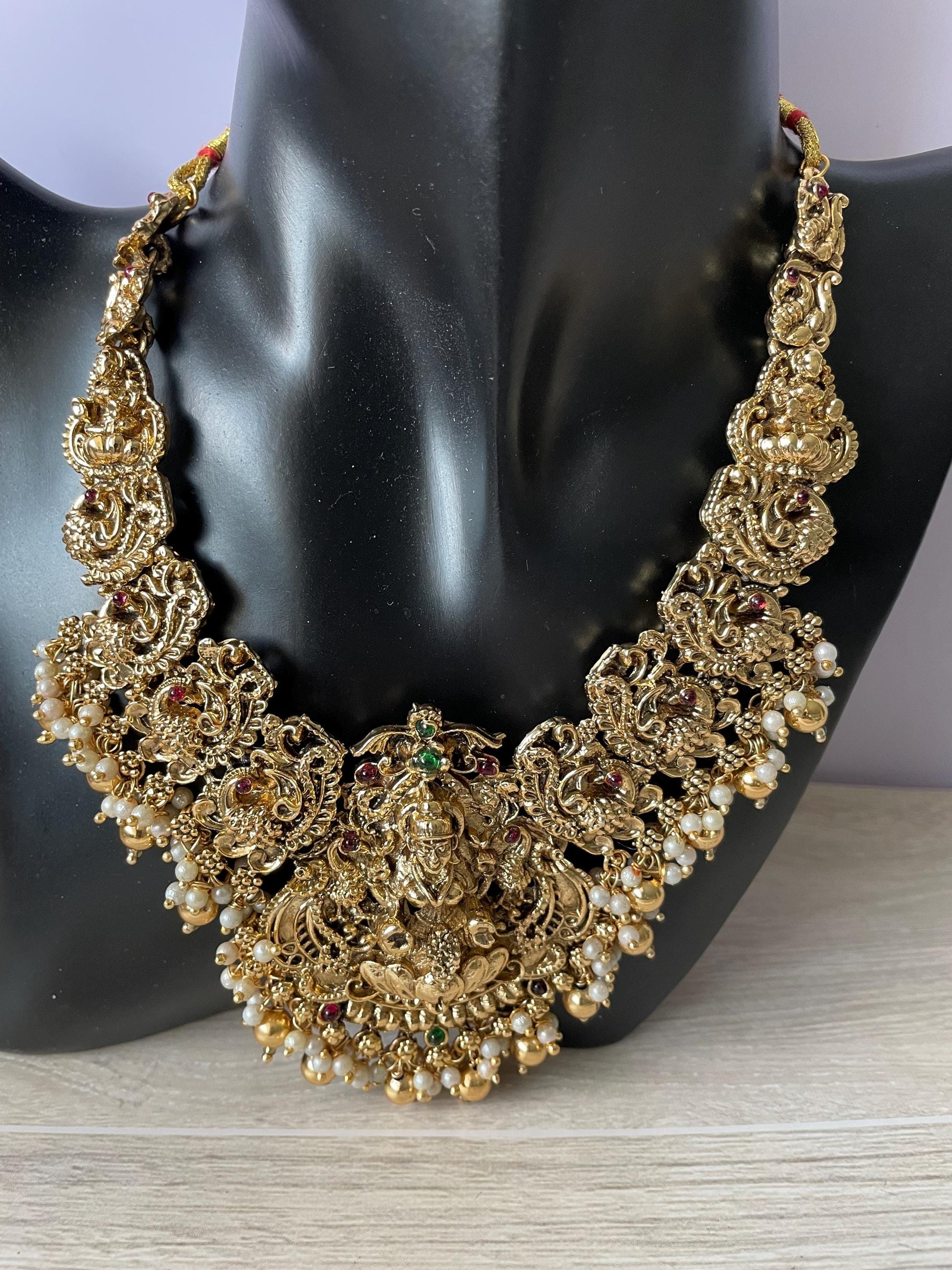 Lakshmi pendent kemp stone antique gold plated choker set with earring in green