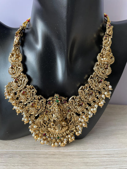 Lakshmi pendent kemp stone antique gold plated choker set with earring in green