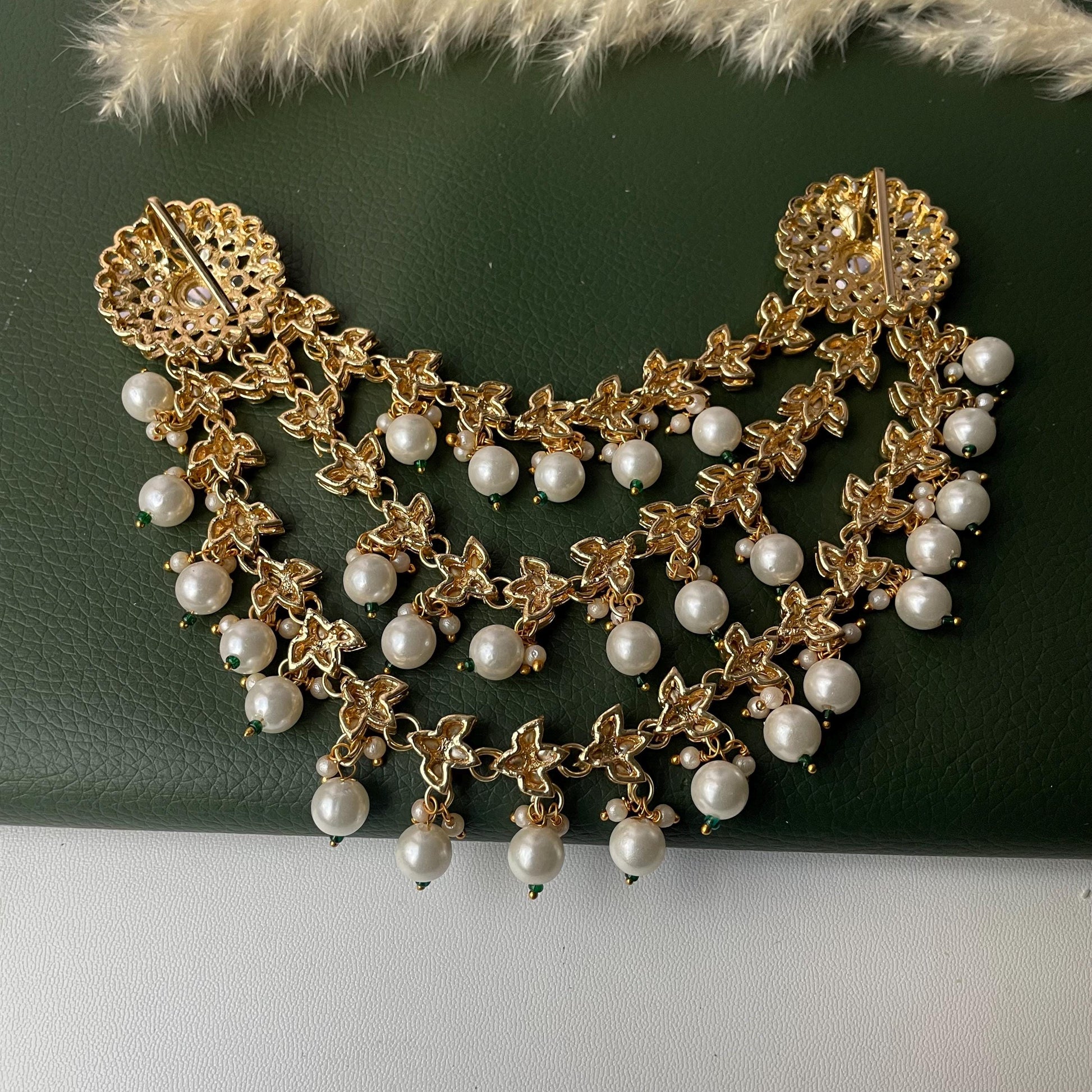 Gold plated kundan and pearl hair accessory