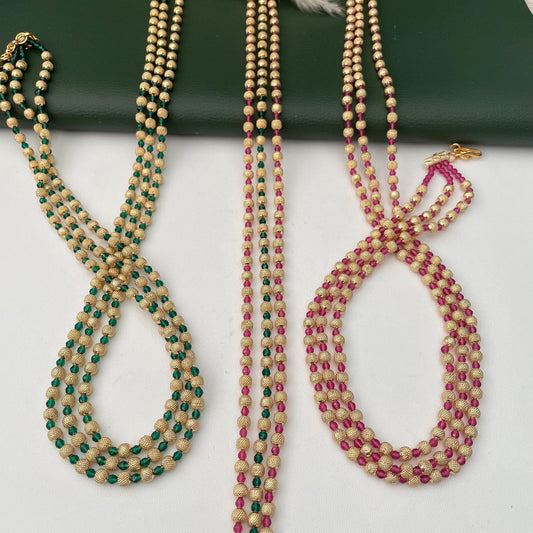Gold plated 3 layered stunning mala in ruby and green color