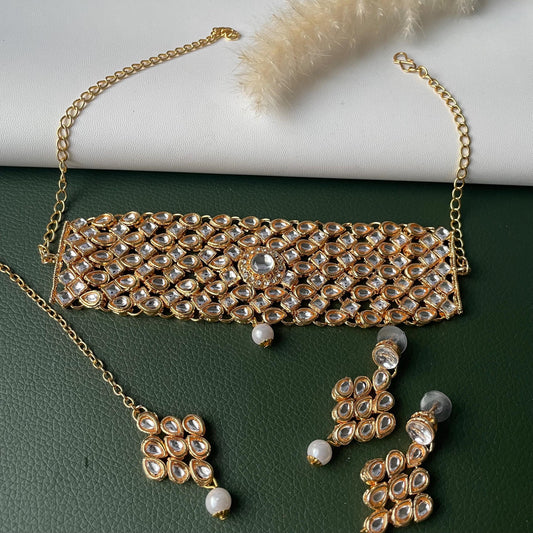 Gold plated kundan choker set with earrings and Maang tikka