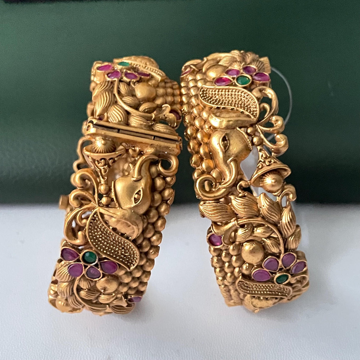 Gold plated kemp stone openable bangles with elephant flower carvings