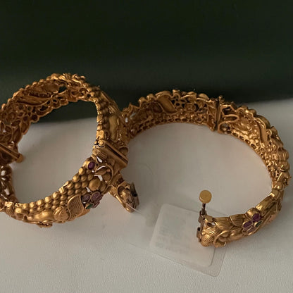 Gold plated kemp stone openable bangles with elephant flower carvings