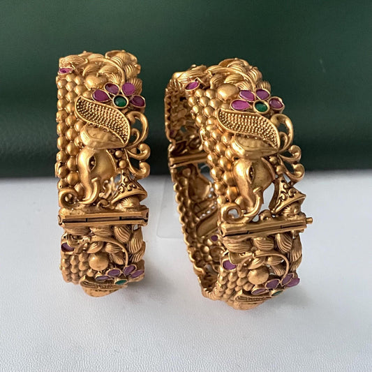 Gold plated kemp stone openable bangles with elephant flower carvings