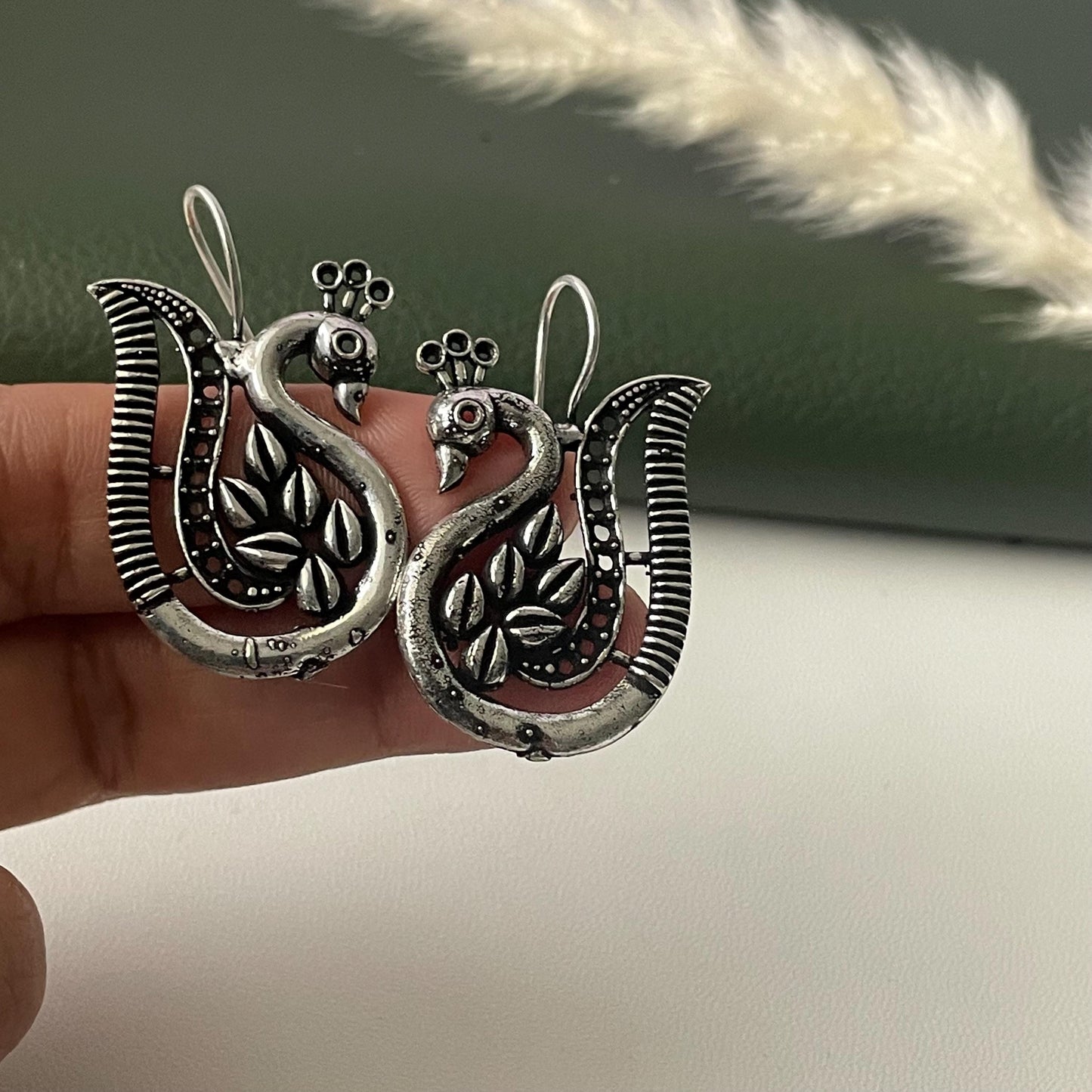Oxidized peacock dangling earrings