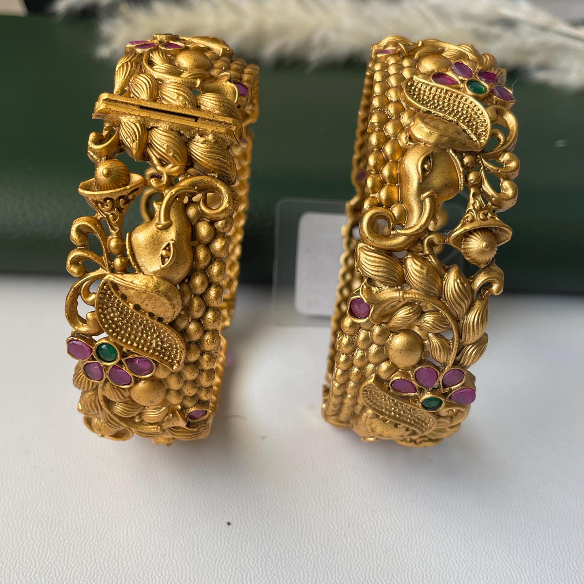 Gold plated kemp stone openable bangles with elephant flower carvings