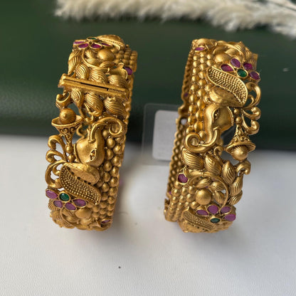 Gold plated kemp stone openable bangles with elephant flower carvings