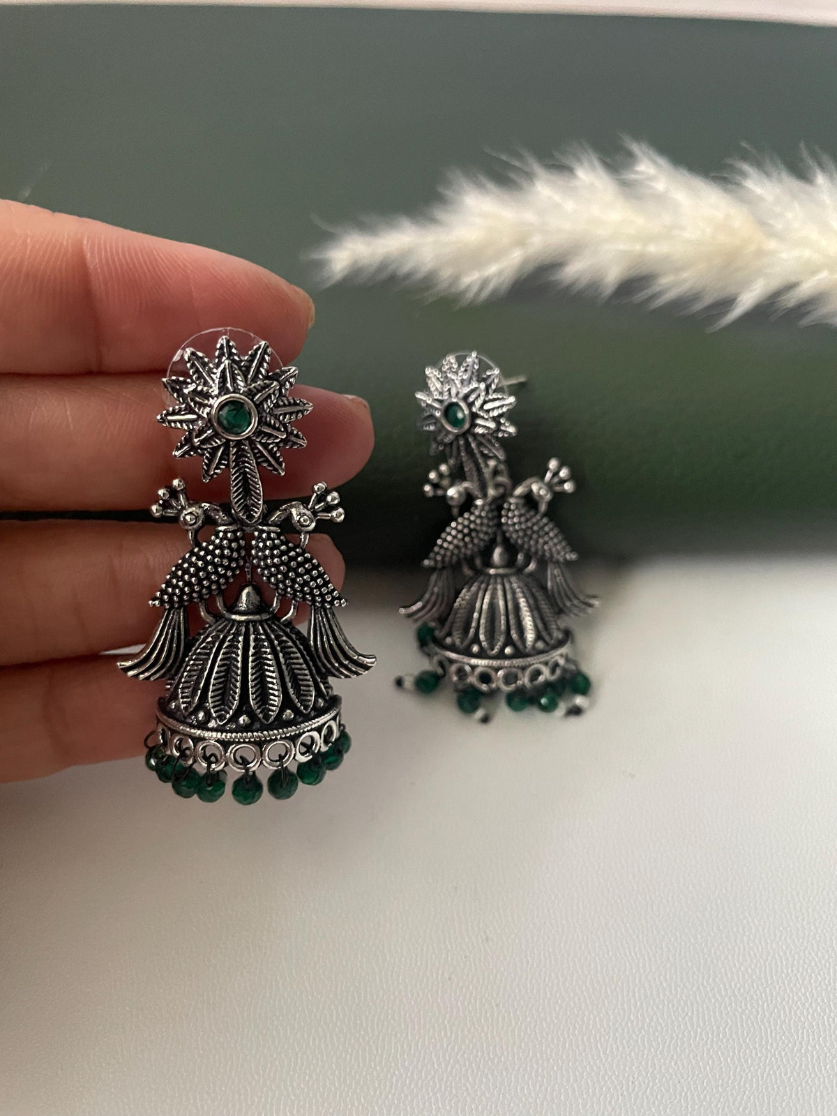 Oxidised green or ruby beads peacock half jhumkis