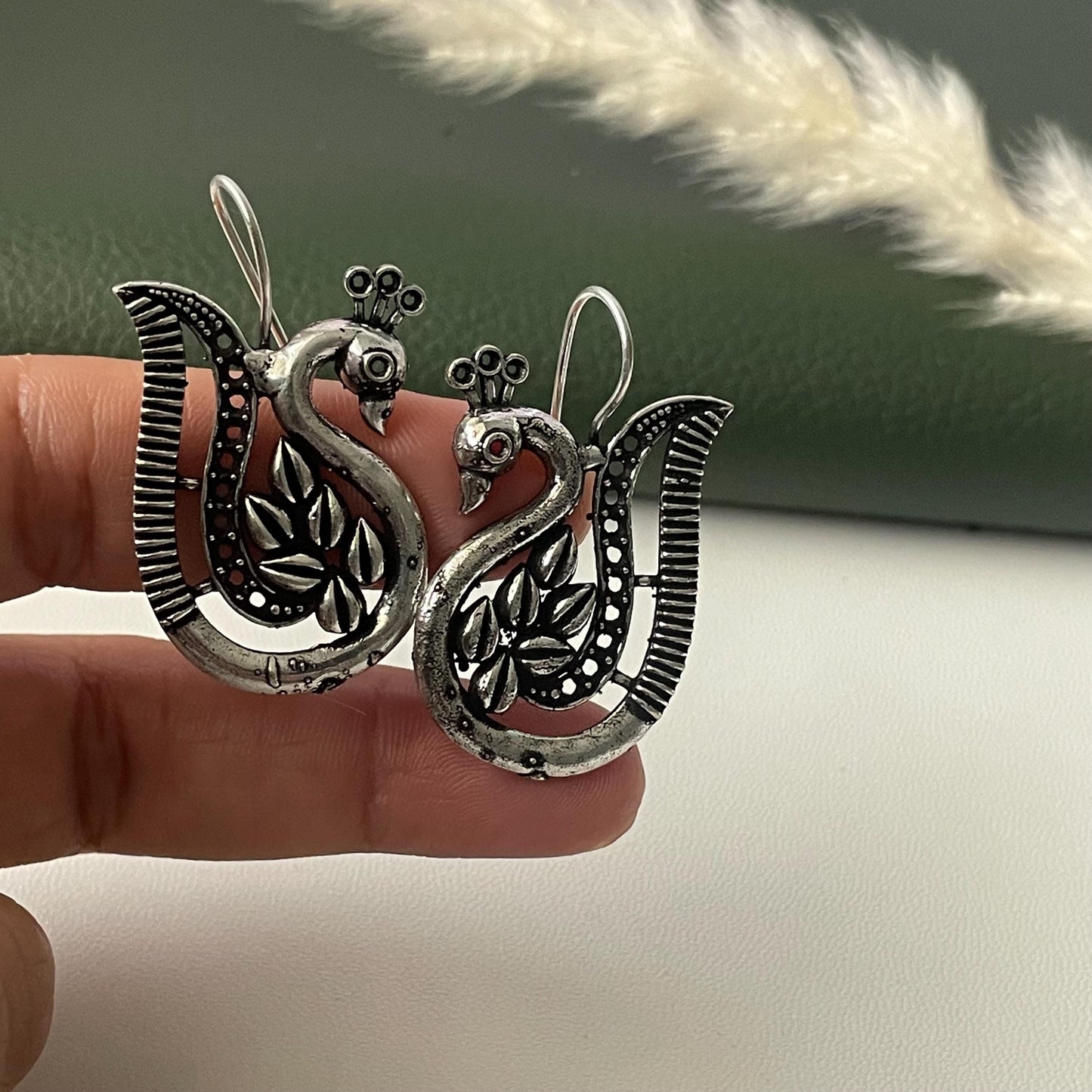 Oxidized peacock dangling earrings