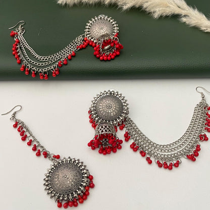 Oxidised jhumkis with ear-chains and Maang tikka