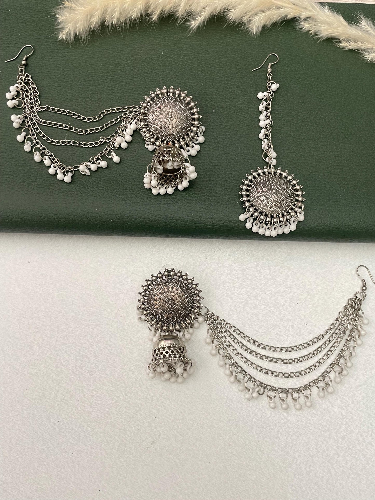 Oxidised jhumkis with ear-chains and Maang tikka