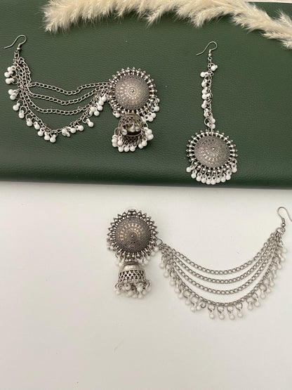 Oxidised jhumkis with ear-chains and Maang tikka