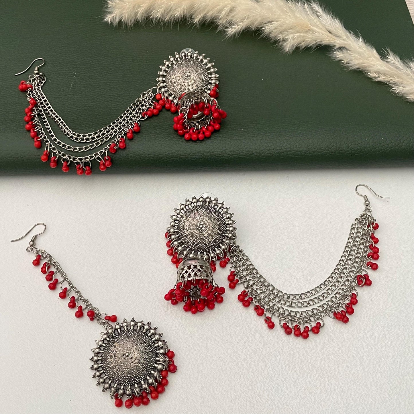 Oxidised jhumkis with ear-chains and Maang tikka