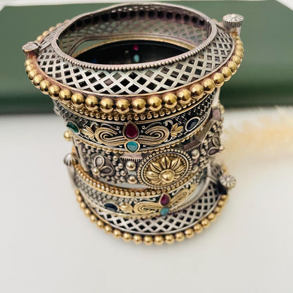 Trendy dual tone wide width Oxidised bangles . These are set of 5 bangles in dual tone. Little heavy and very intricate designed
