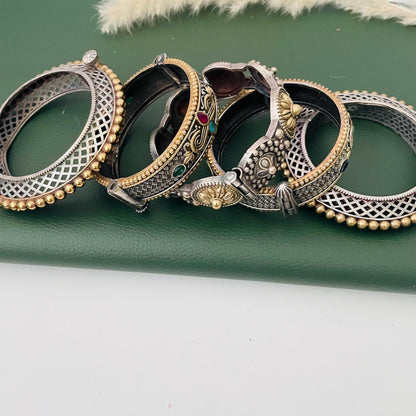 Trendy dual tone wide width Oxidised bangles . These are set of 5 bangles in dual tone. Little heavy and very intricate designed