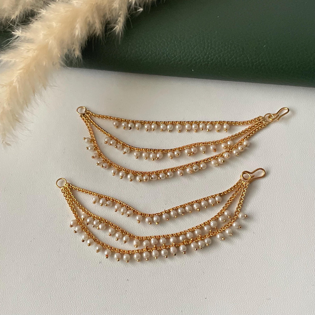 Pearl and golden three layered earchain