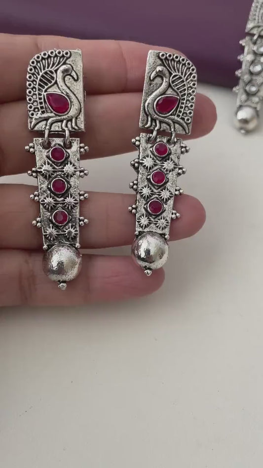 Silver lookalike peacock Oxidised earrings in Ruby and white
